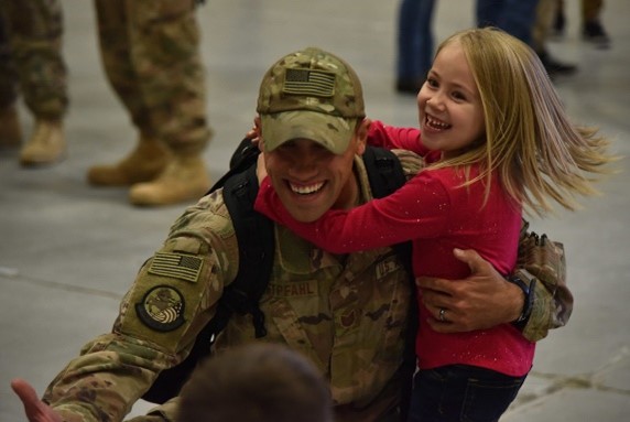 father holding his daughter