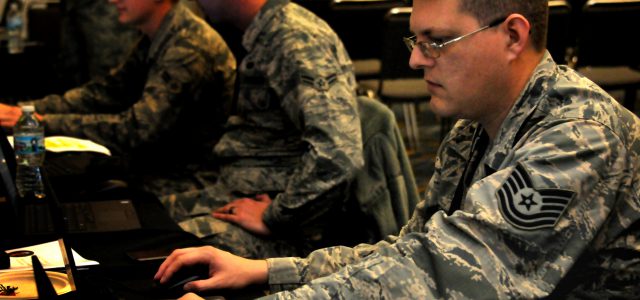 Soldier sitting at a desk
