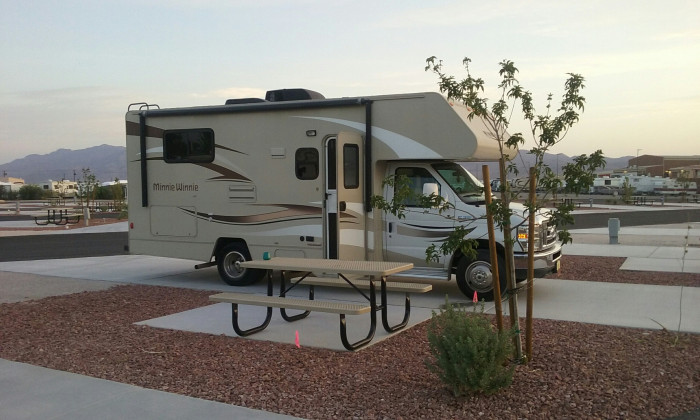 Motor home next to a picnic table