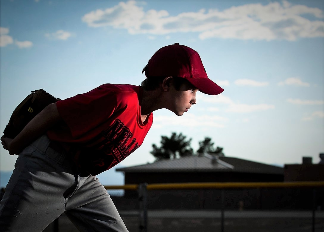 kid on a pitchers mound looking for the call
