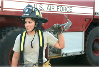 firefighter standing next to a firetruck
